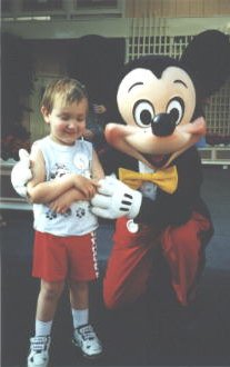 [picture of Bryan and Mickey Mouse]